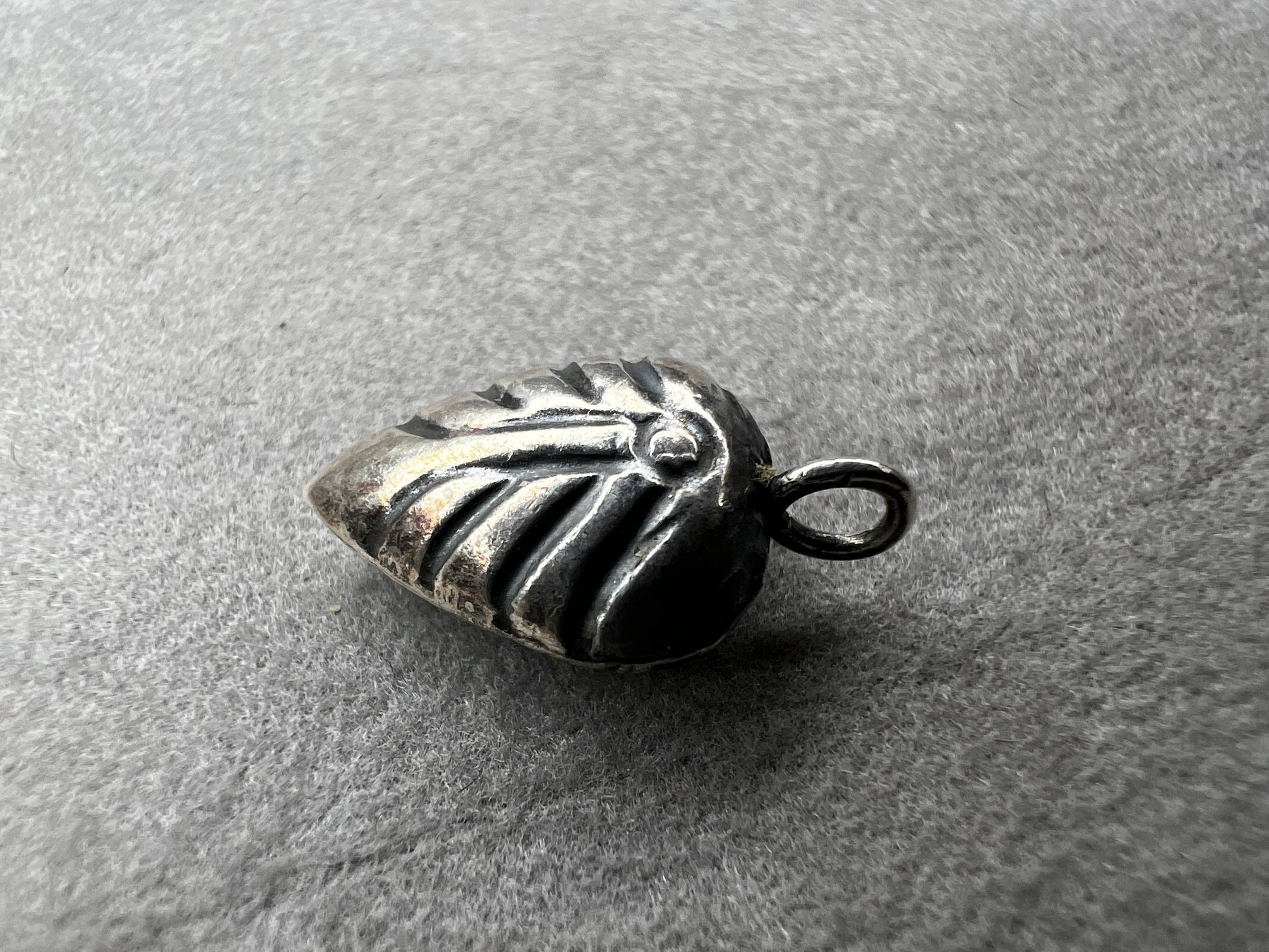 This sterling silver puffed leaf charm features delicate detailing on both sides, adding a subtle touch of nature-inspired elegance to your jewelry. Designed to be attached easily with a jump ring, it’s perfect for customizing your bracelet or necklace with a meaningful accent.
