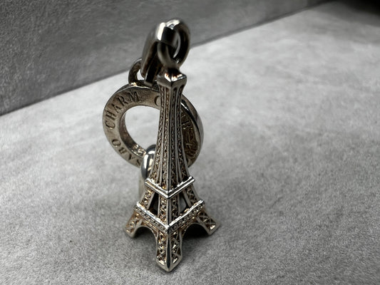 This Thomas Sabo Eiffel Tower charm offers versatile style as both a charm and a pendant. Crafted in sterling silver, it adds a timeless Parisian touch to your jewelry collection, perfect for expressing your love of travel or iconic landmarks.