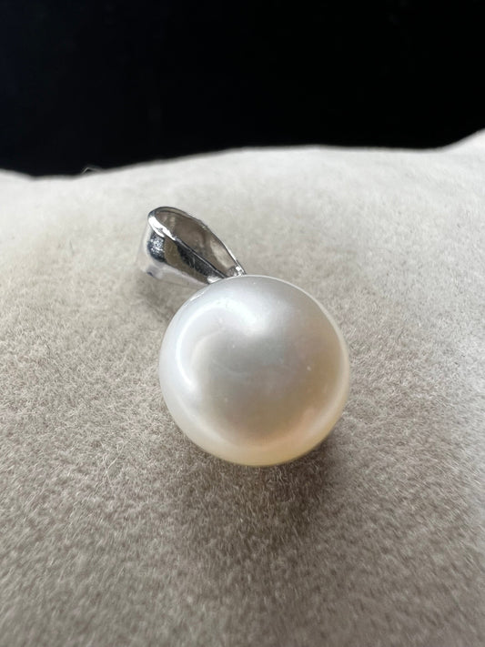 This sterling silver and pearl pendant is perfect for just a touch of elegance. It's ready to pair with one of our silver chains.