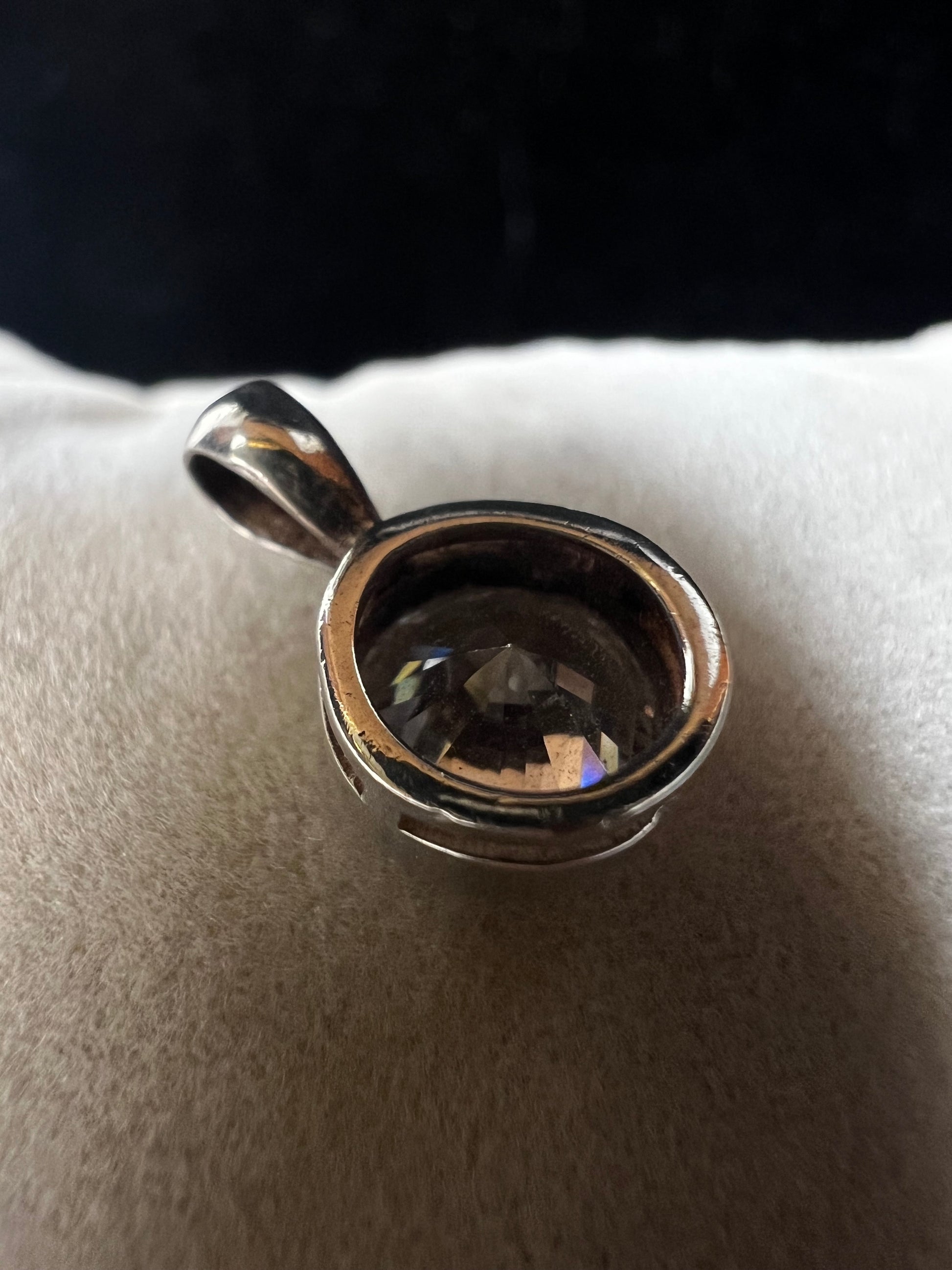 This petite pendant showcases a tourmaline set in sterling silver, offering a subtle yet elegant touch of class. Its delicate size makes it perfect for layering or wearing alone, and it pairs well with our small sterling chains.