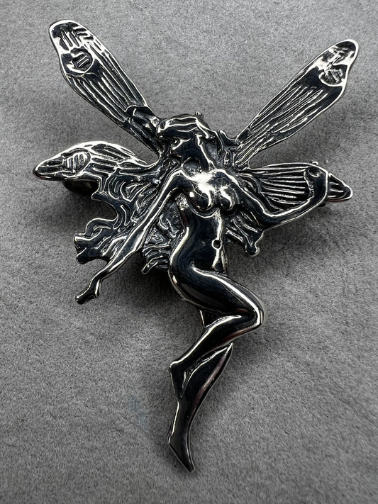 Crafted from sterling silver, this 2" nude goddess fairy brooch from the 1980s adds a unique touch to the right outfit or special occasion.