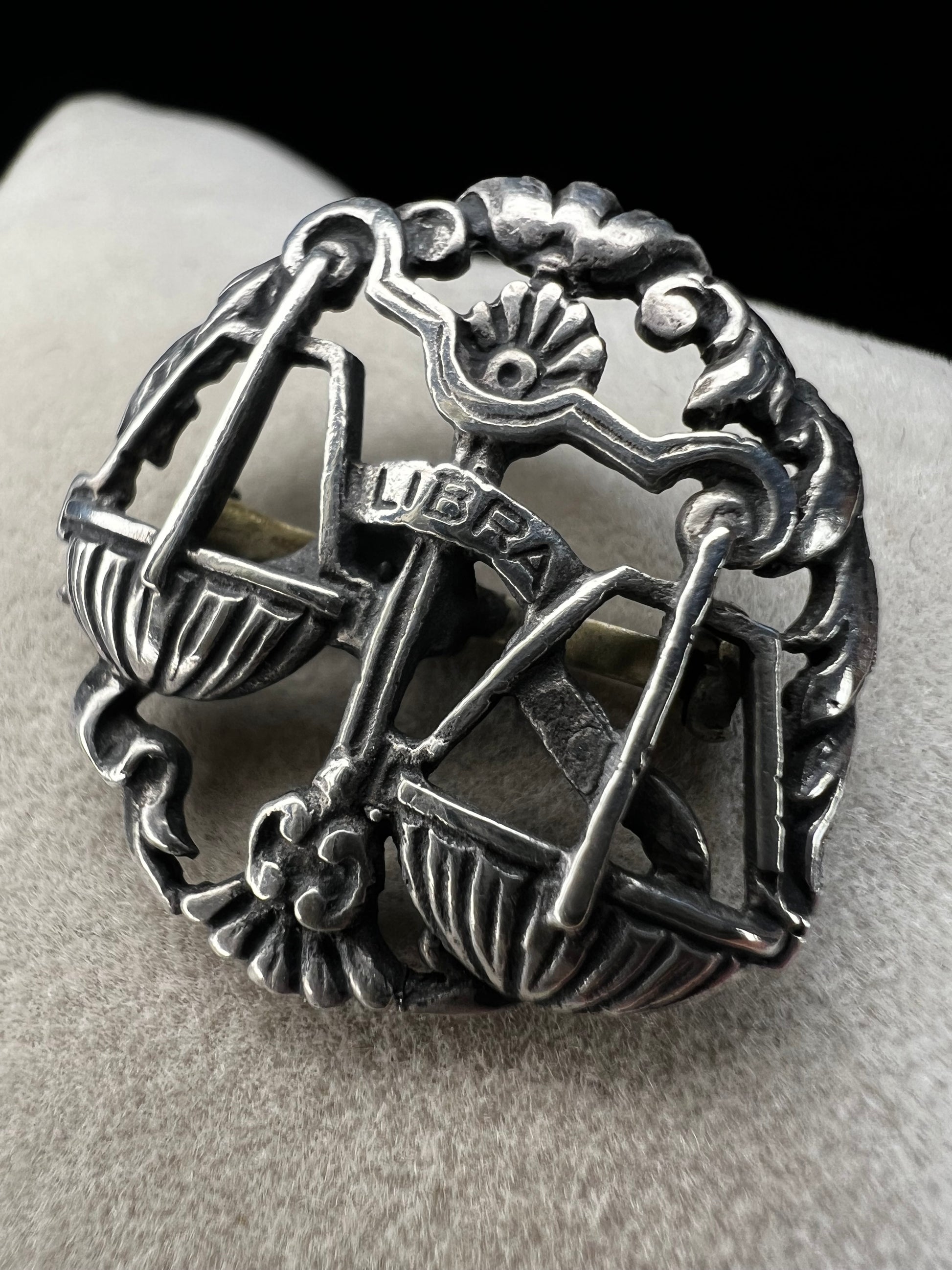 Celebrate the charm of the Libra zodiac sign with this vintage sterling silver brooch. Its timeless design makes it a thoughtful gift for anyone who appreciates astrology.