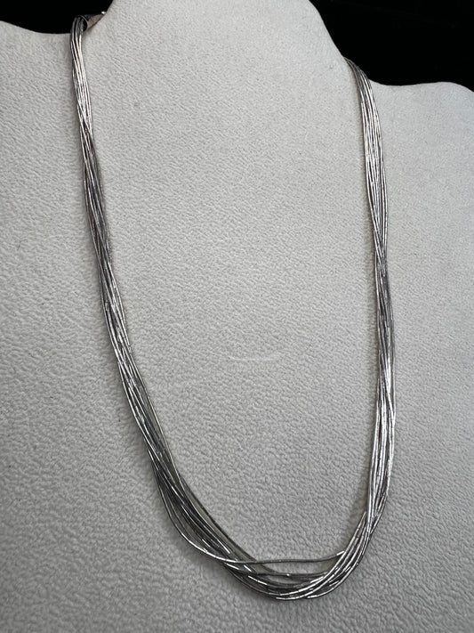 This 18-inch sterling silver "Liquid Sterling" necklace features 10 delicate strands that move gracefully with you, capturing and reflecting light beautifully.