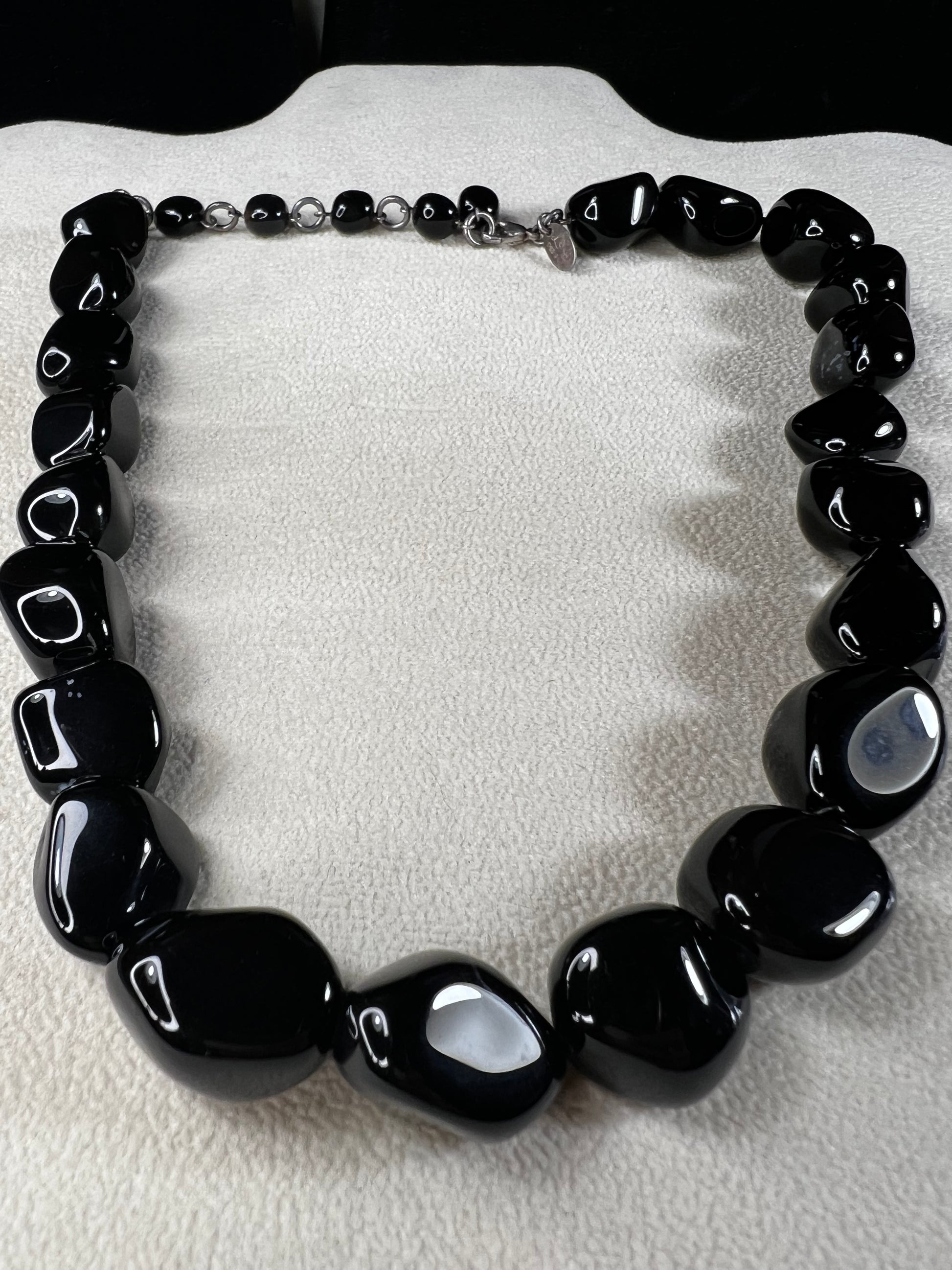 This necklace from LSB Designs features natural black onyx beads and sterling silver, combining striking beauty with lasting durability. Designed to impress, it offers a bold yet elegant accessory that enhances any look.