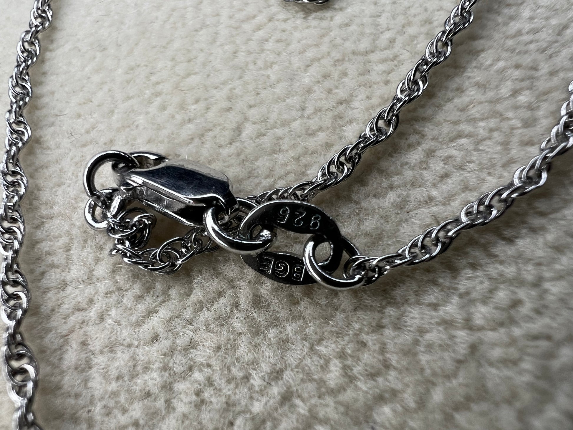 This petite sterling silver rope chain offers a delicate and elegant look, perfect for everyday wear. It pairs beautifully with smaller pendants or can be worn alone for a subtle touch of sophistication.