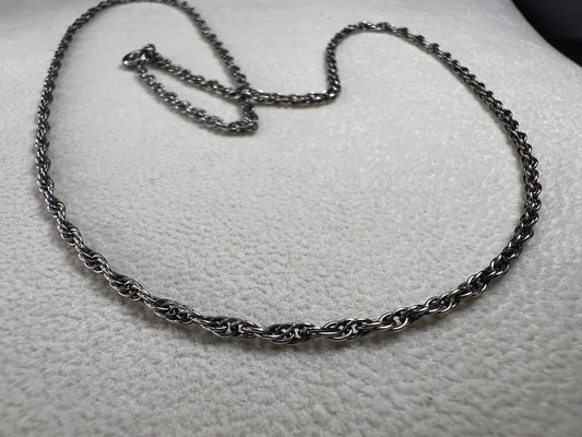 This vintage classic sterling silver 18" rope chain offers a subtle touch of timeless style. Its delicate design works beautifully on its own or as a perfect complement to one of our pendants.