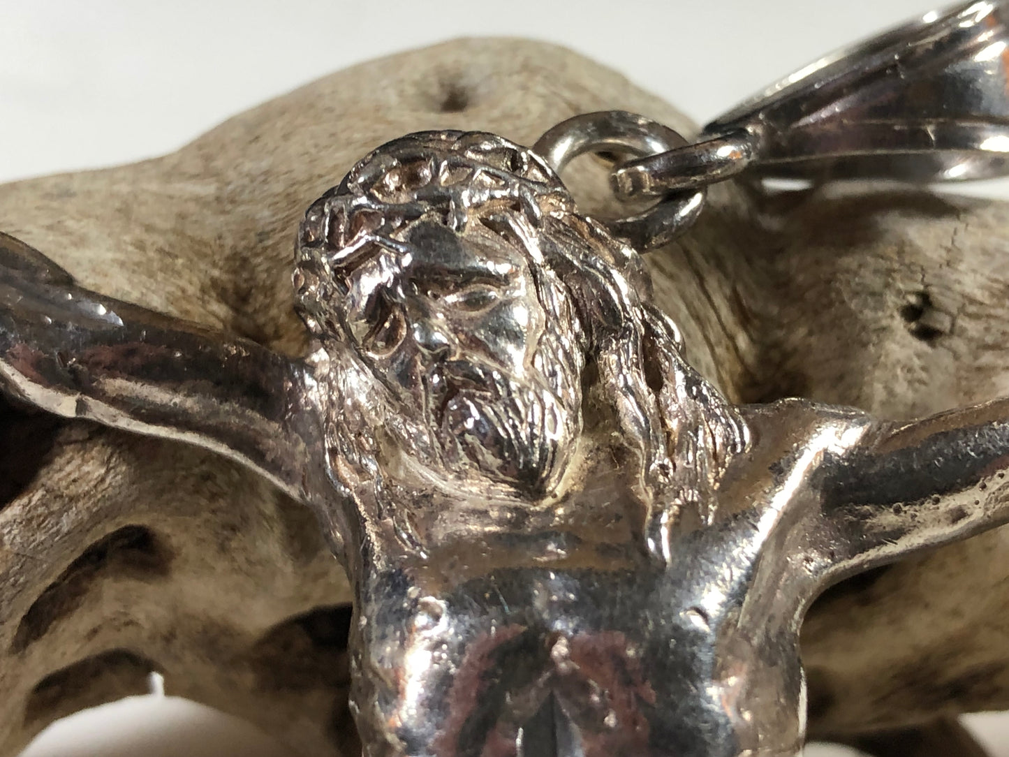 This hand-crafted sterling silver pendant, featuring Jesus with arms outstretched as if on the Cross, is an impressive 4.75 inches from toe-tip to the bail's top. On the back of this piece, "1 of a kind" is inscribed.