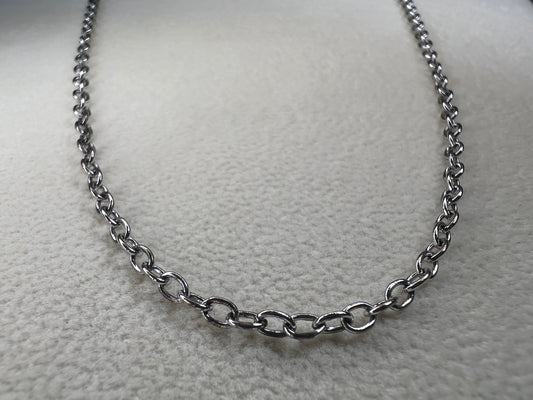 This 24" sterling silver cable chain offers a durable and elegant look that works beautifully on its own or combined with your favorite pendant. Its sturdy design ensures long-lasting wear while adding a subtle shine to your everyday style.