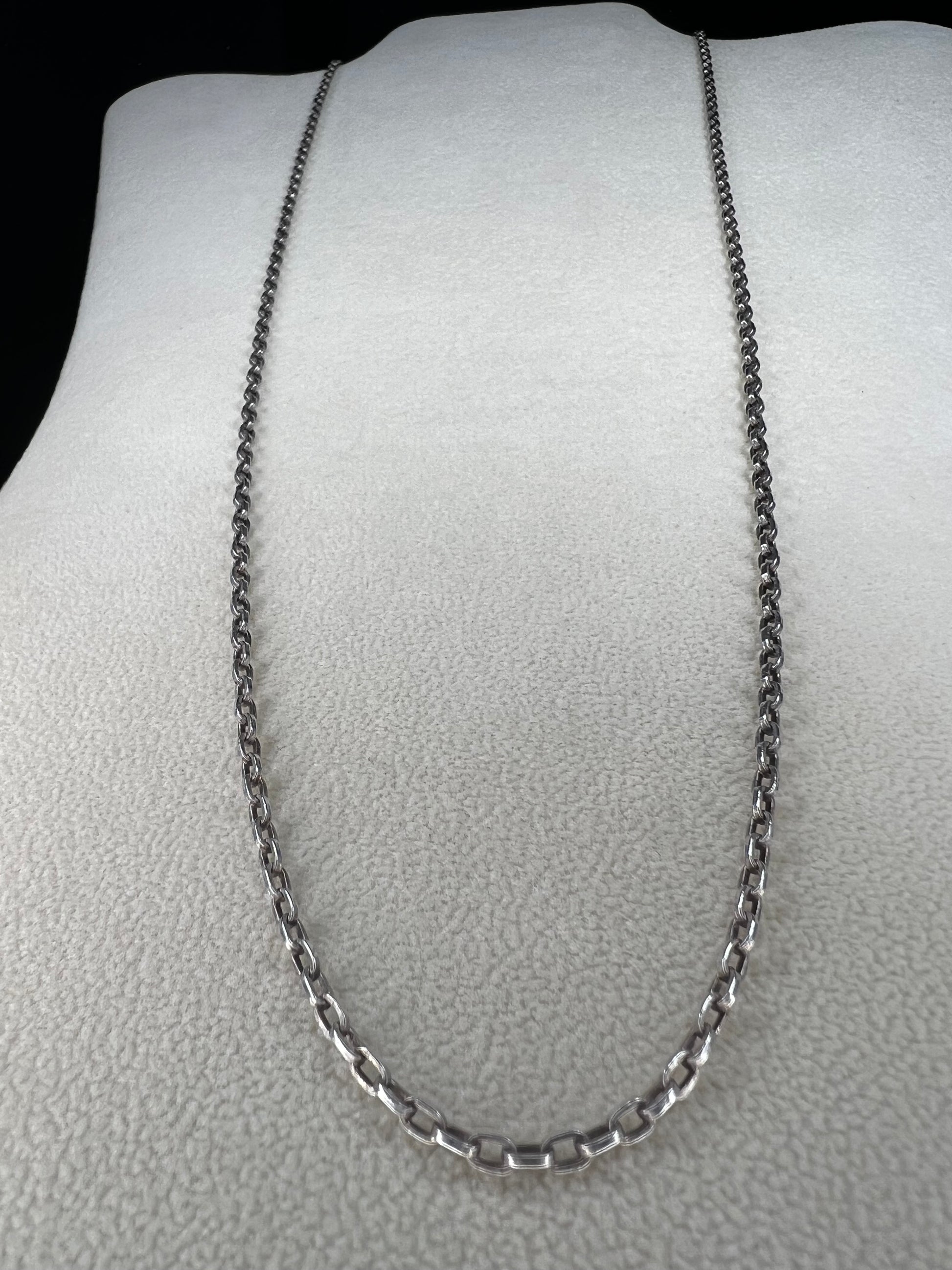 This vintage 26" sterling silver cable chain offers a strong, durable design that stands out beautifully on its own or complements any pendant with ease. Its classic style and reliable construction would make it a versatile addition to your jewelry collection.