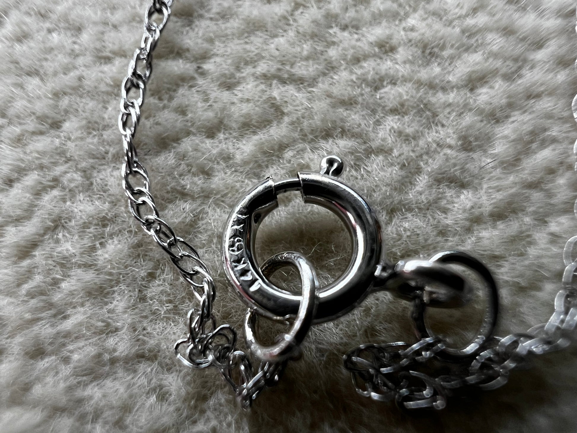 This petite 21" 14 karat white gold chain is a delicate touch of everyday elegance. It's so light that you’ll barely notice it’s there, catching the light to add subtle shine throughout your day. Perfect for layering or wearing alone.