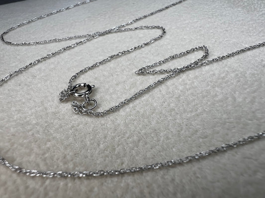 This petite 21" 14 karat white gold chain is a delicate touch of everyday elegance. It's so light that you’ll barely notice it’s there, catching the light to add subtle shine throughout your day. Perfect for layering or wearing alone.