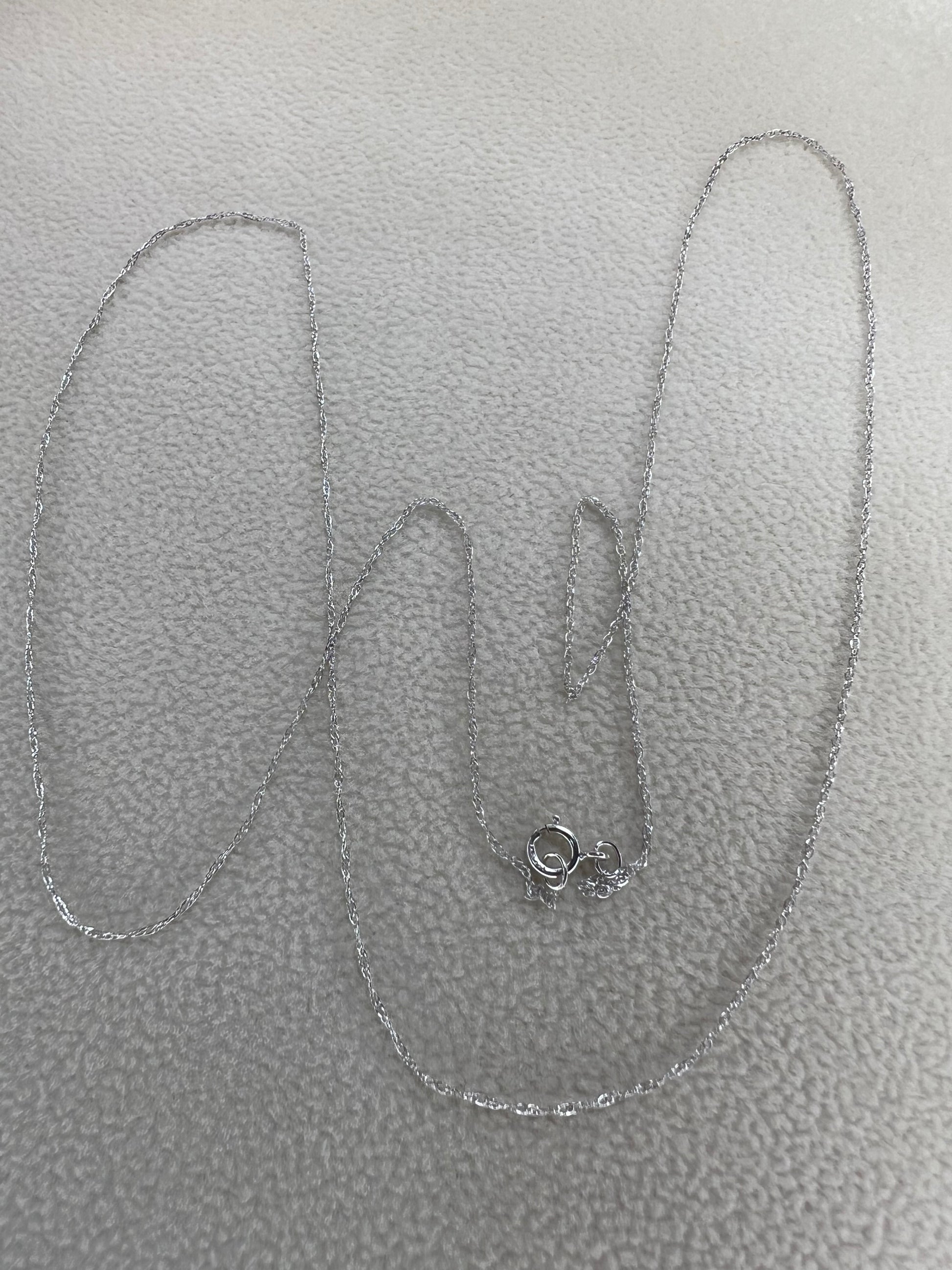 This petite 21" 14 karat white gold chain is a delicate touch of everyday elegance. It's so light that you’ll barely notice it’s there, catching the light to add subtle shine throughout your day. Perfect for layering or wearing alone.