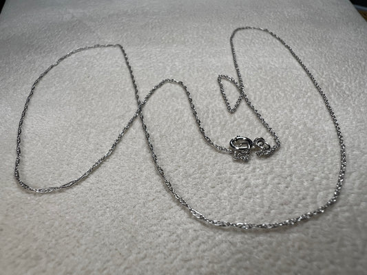 This petite 21" 14 karat white gold chain is a delicate touch of everyday elegance. It's so light that you’ll barely notice it’s there, catching the light to add subtle shine throughout your day. Perfect for layering or wearing alone.