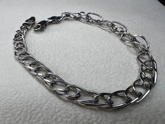 This sterling silver bracelet showcases a timeless design that stands out on its own or can be personalized as a charm bracelet.