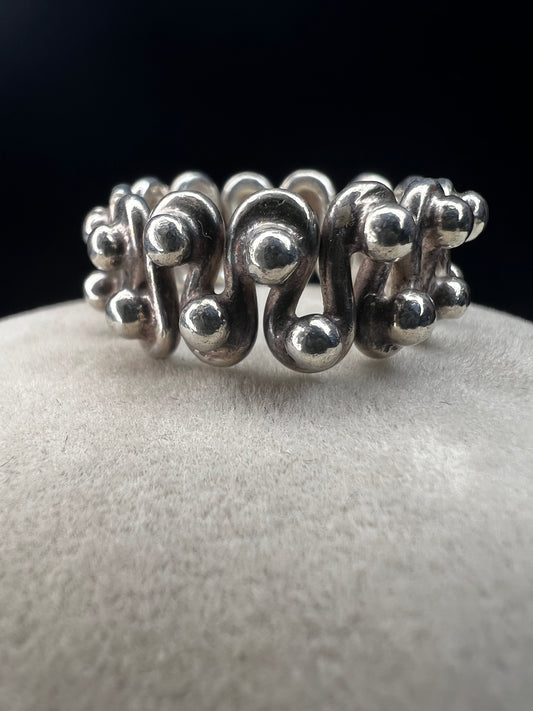 Add a dash of timeless charm to your style with this vintage sterling silver ring. Its unique design captures a playful spirit and will bring a one-of-a-kind flair to any outfit.