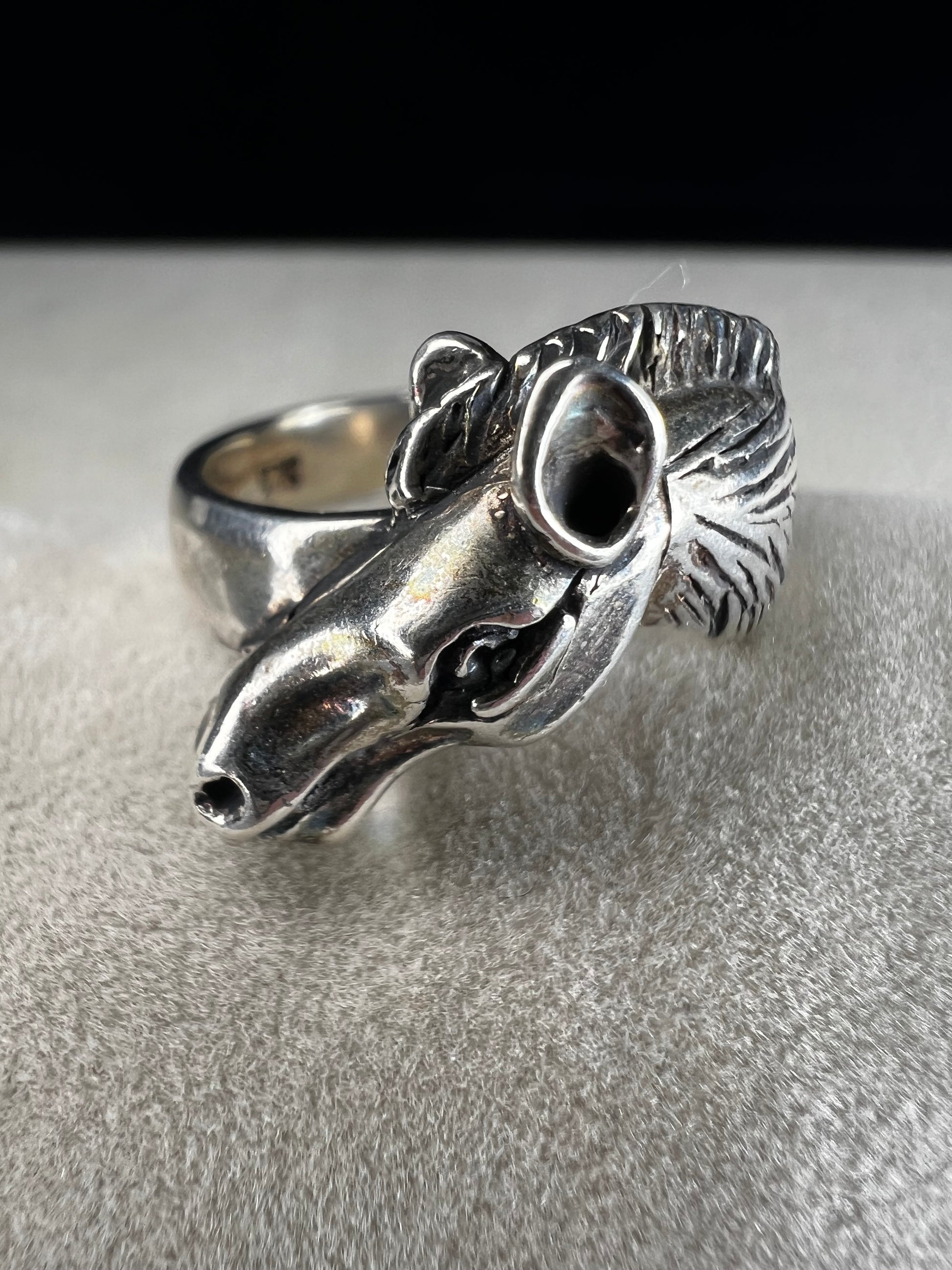 Expertly crafted from sterling silver, this ring showcases a meticulously detailed horse head, capturing the essence of equine beauty with precision. Perfect for anyone who has a love for horses.