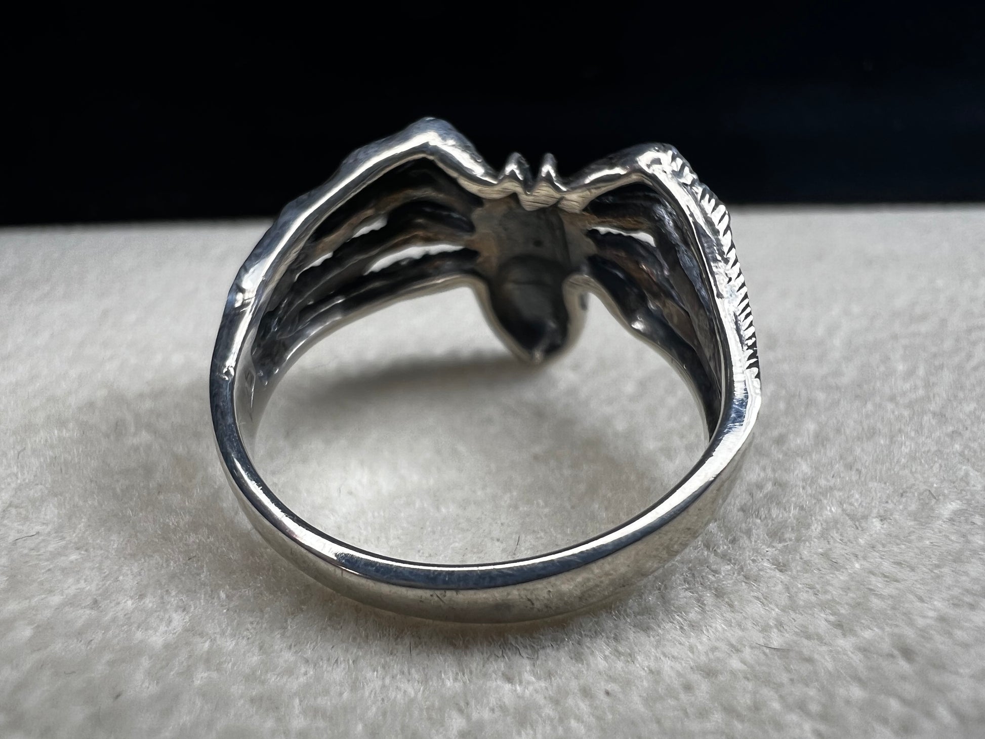 Crafted from sterling silver, this realistically detailed spider ring offers a unique and striking accessory for special occasions. Its intricate design adds a distinctive touch, making it a perfect choice for those who want to express their bold style with confidence.