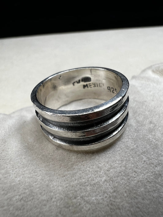 Experience timeless elegance with this vintage Mexican sterling silver ring. Crafted with a wide band and authentic silversmith stamping, it guarantees genuine quality and character. Perfect for anyone seeking a unique piece that carries both history and style.