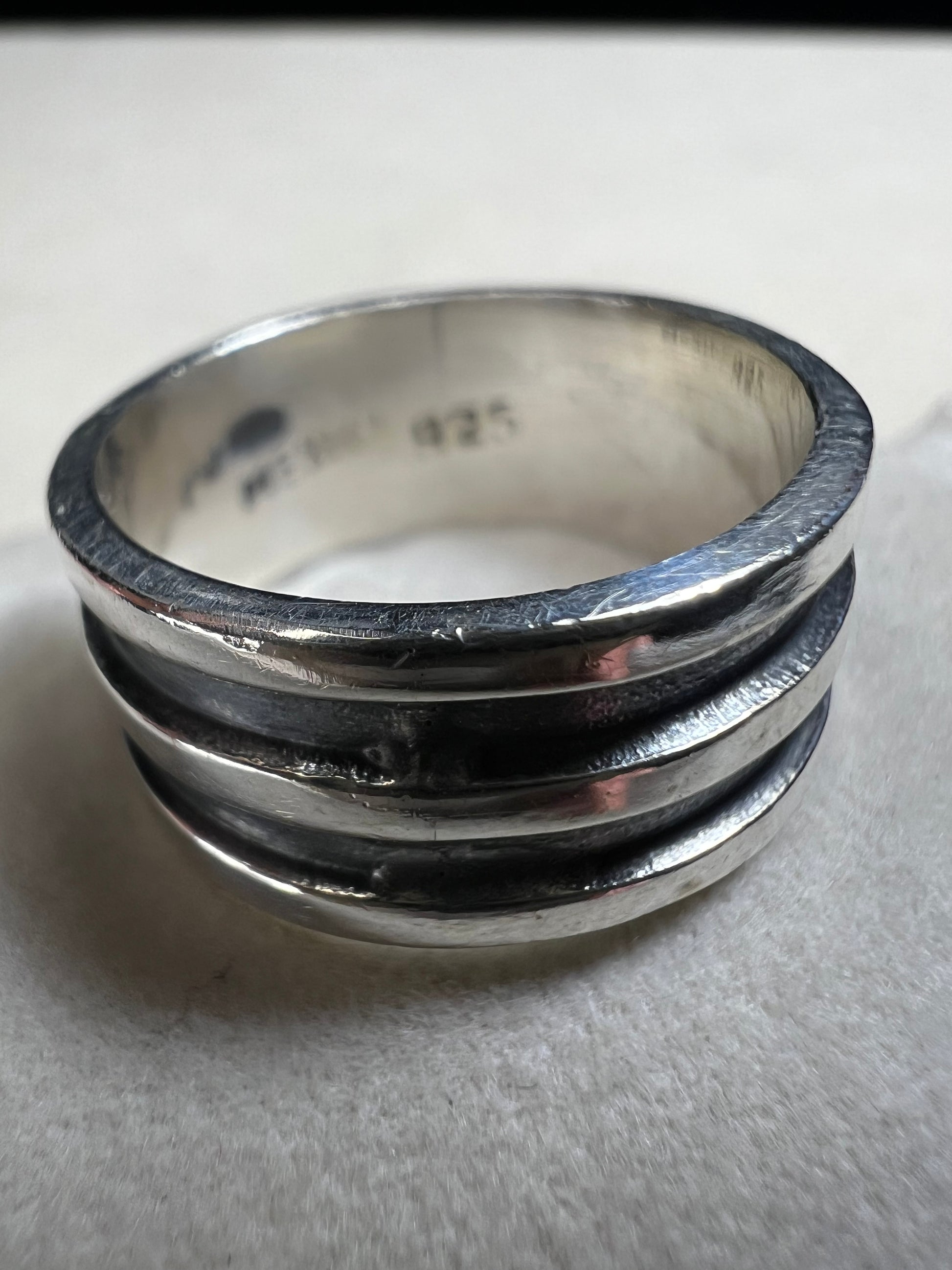 Experience timeless elegance with this vintage Mexican sterling silver ring. Crafted with a wide band and authentic silversmith stamping, it guarantees genuine quality and character. Perfect for anyone seeking a unique piece that carries both history and style.