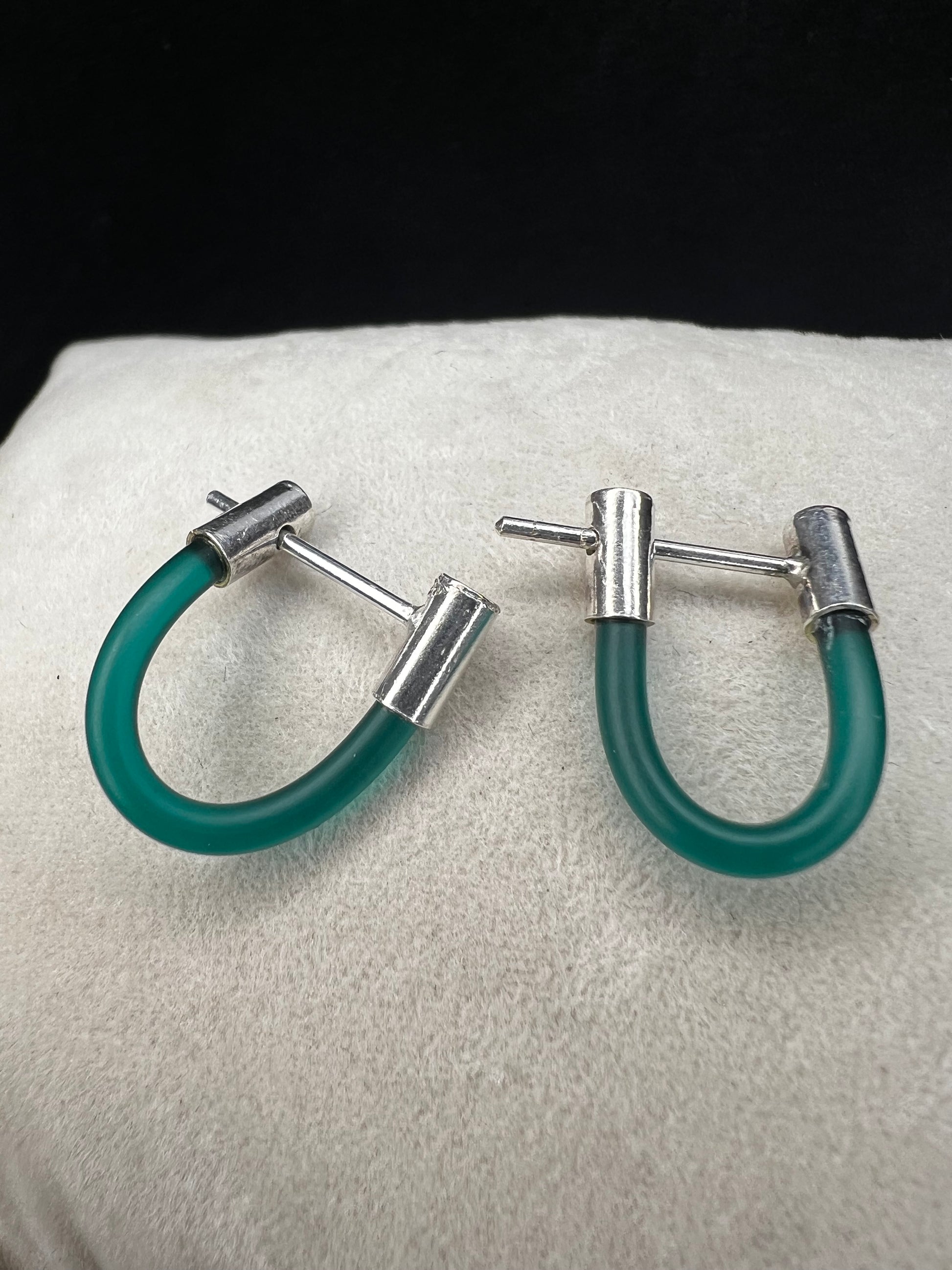 Complement your outfit with these unique earrings. They will add a nice pop of color.