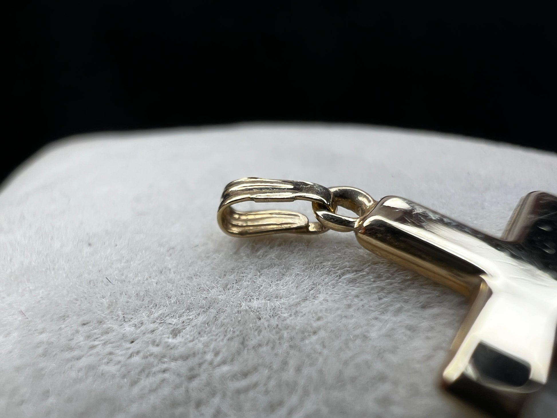 This 10 karat gold cross is a nice classic piece to pair with one of our gold chains.