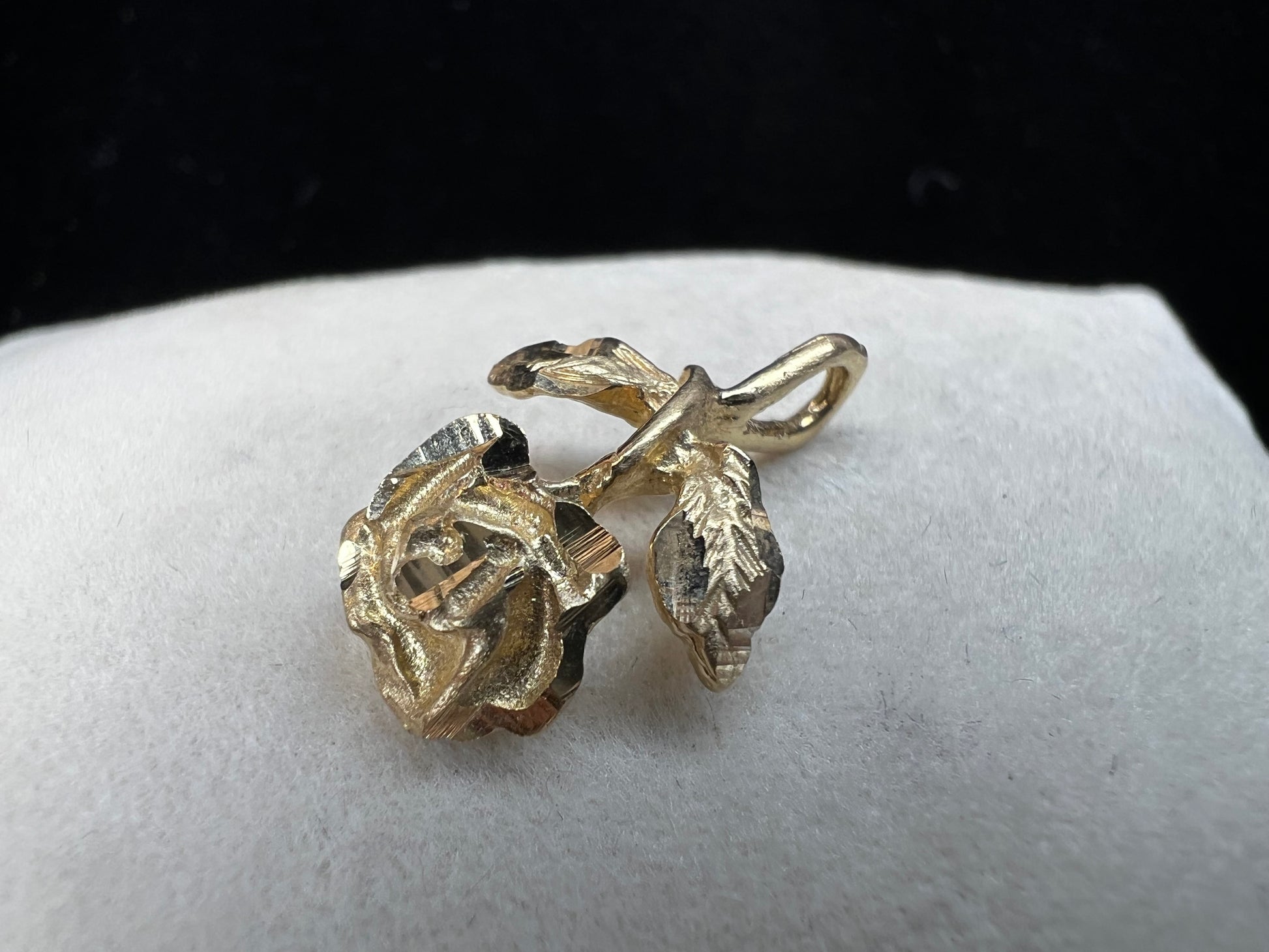 Expertly crafted from one solid piece of 14 karat gold, this pendant features a stunning flower and bail designed to last.