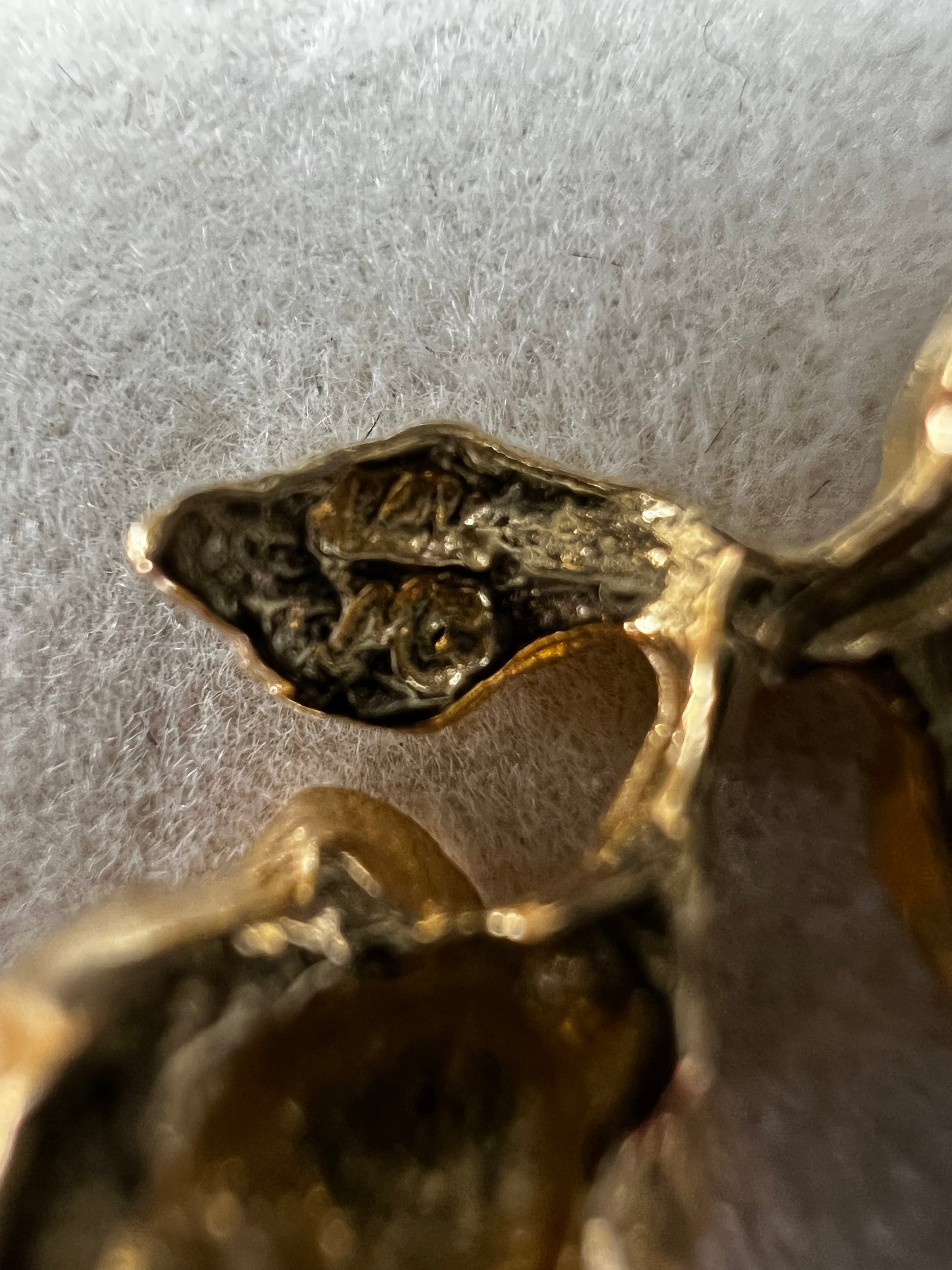 Expertly crafted from one solid piece of 14 karat gold, this pendant features a stunning flower and bail designed to last.