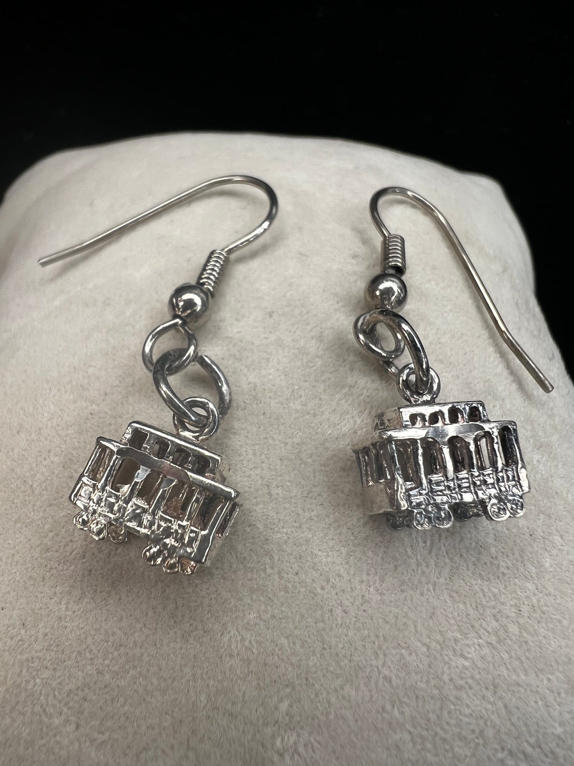 Made from sterling silver, these trolley earrings would be a cute addition to any outfit.