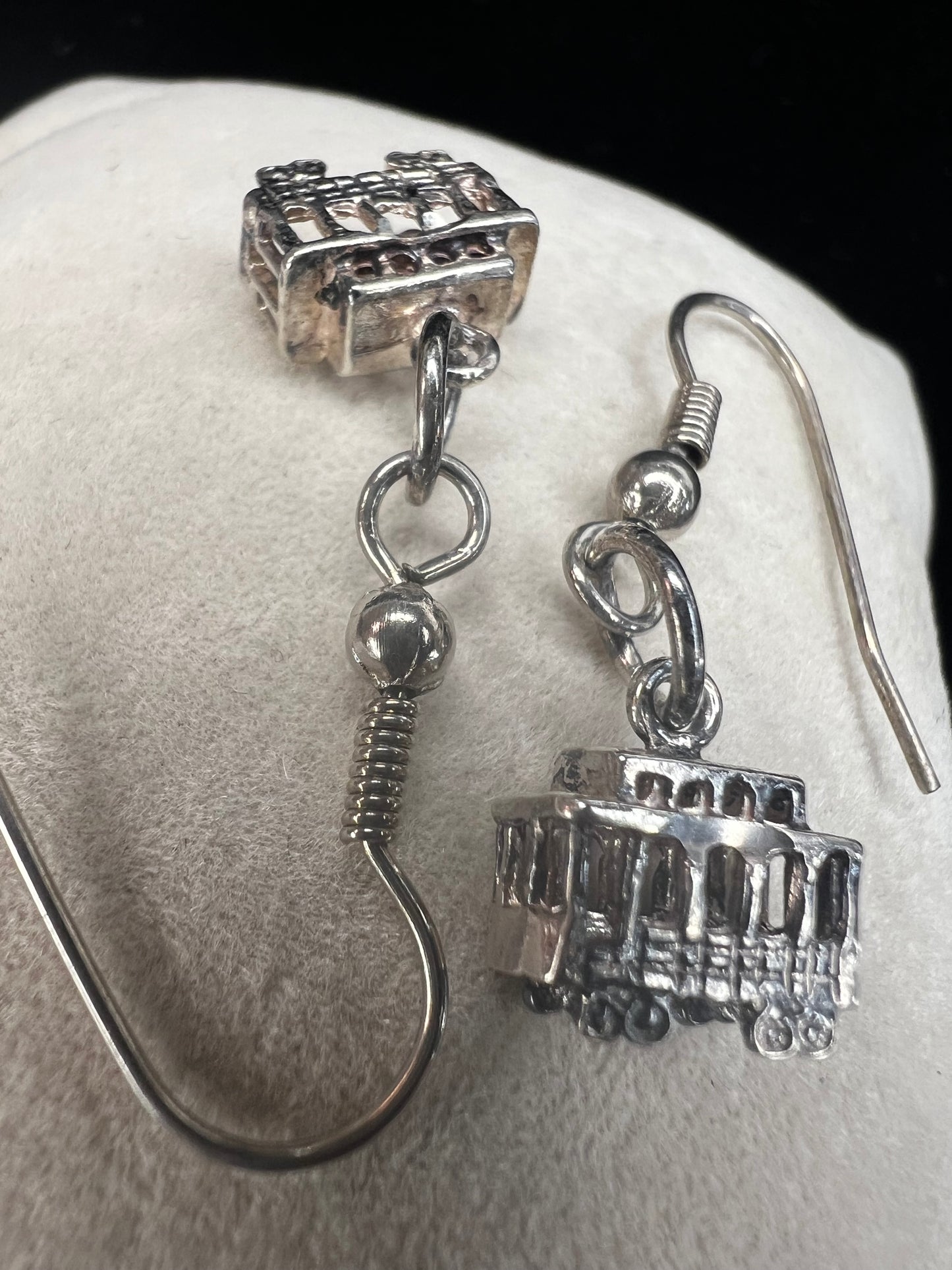 Made from sterling silver, these trolley earrings would be a cute addition to any outfit.