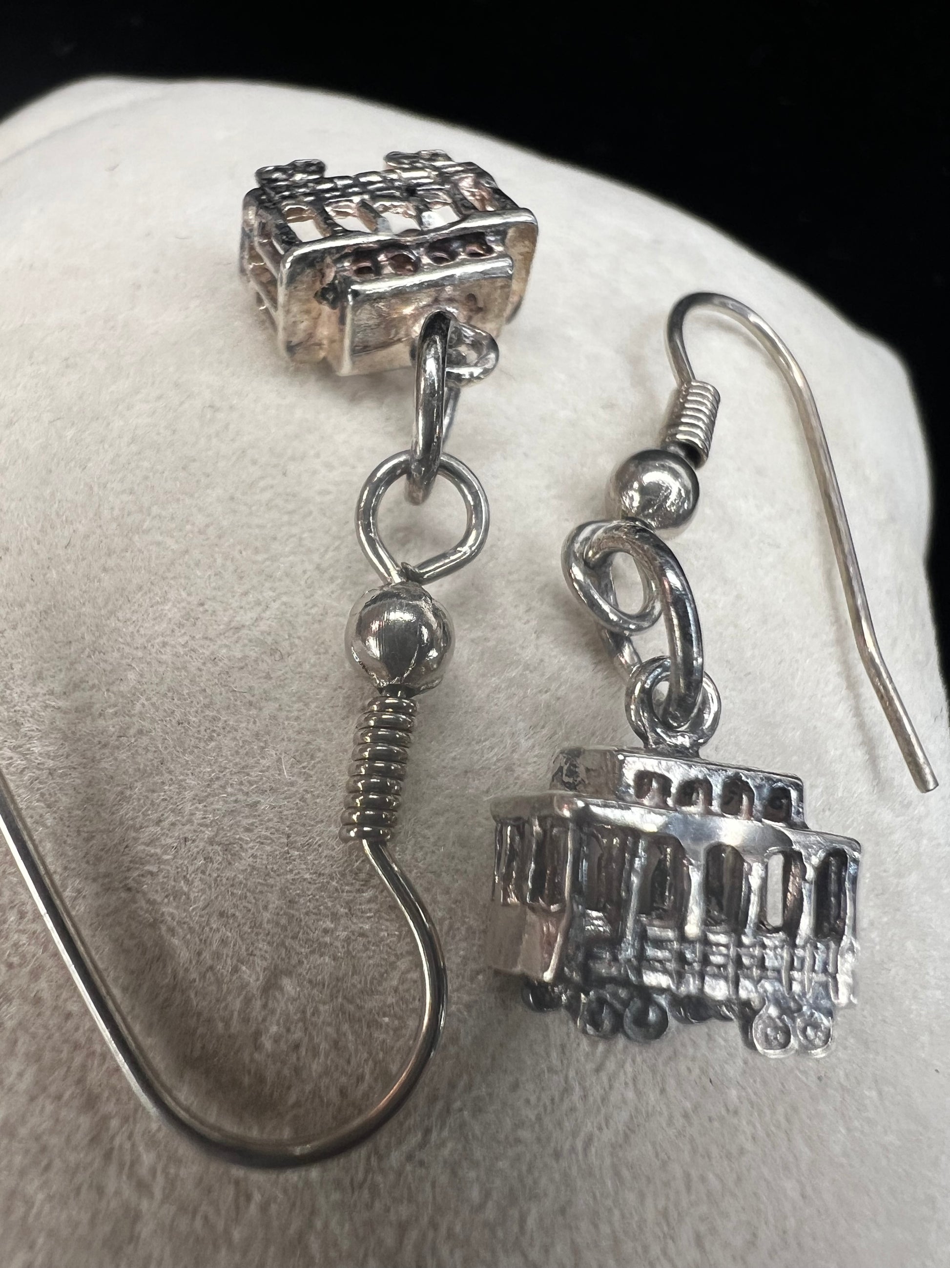 Made from sterling silver, these trolley earrings would be a cute addition to any outfit.