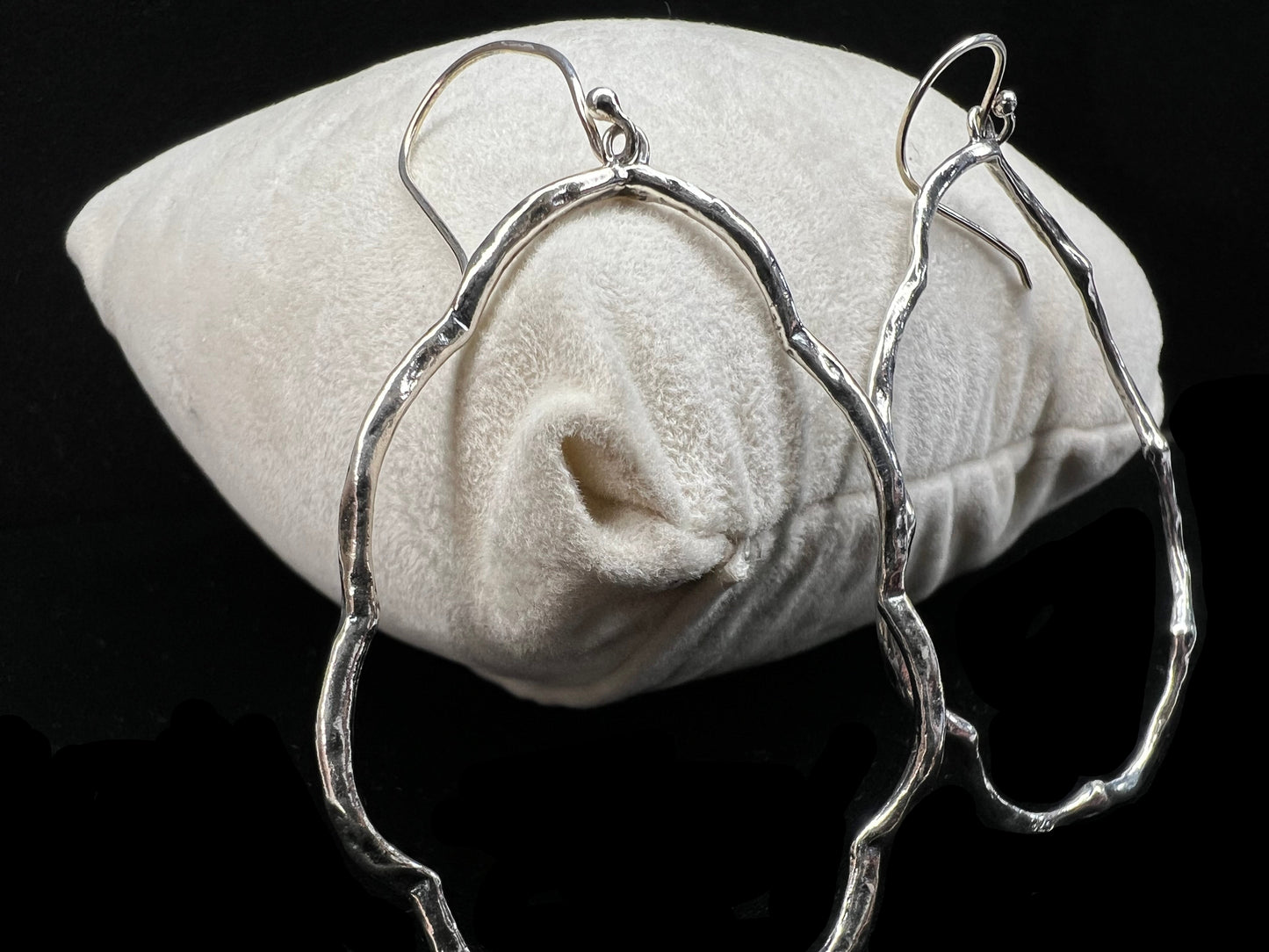 These hammered and scalloped sterling silver earrings will add a bit of flash to your outfit.