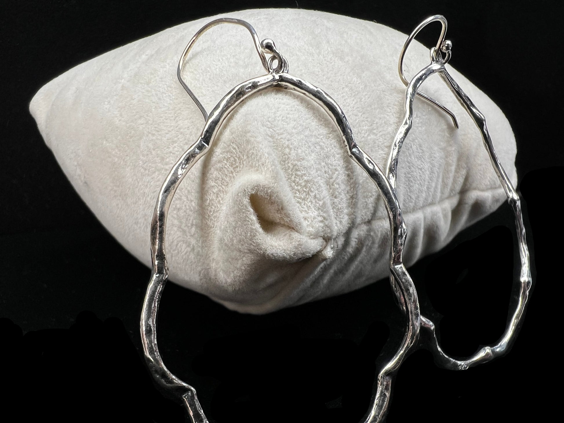 These hammered and scalloped sterling silver earrings will add a bit of flash to your outfit.