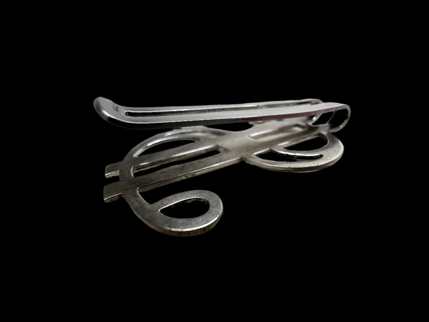 This vintage piece is crafted from sterling silver and designed to hold folded cash. If you're looking for a unique gift, this fits the bill.