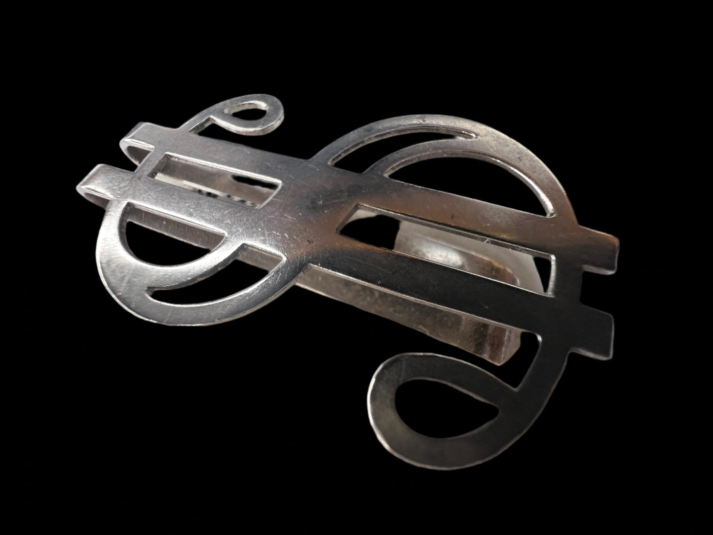 This vintage piece is crafted from sterling silver and designed to hold folded cash. If you're looking for a unique gift, this fits the bill.
