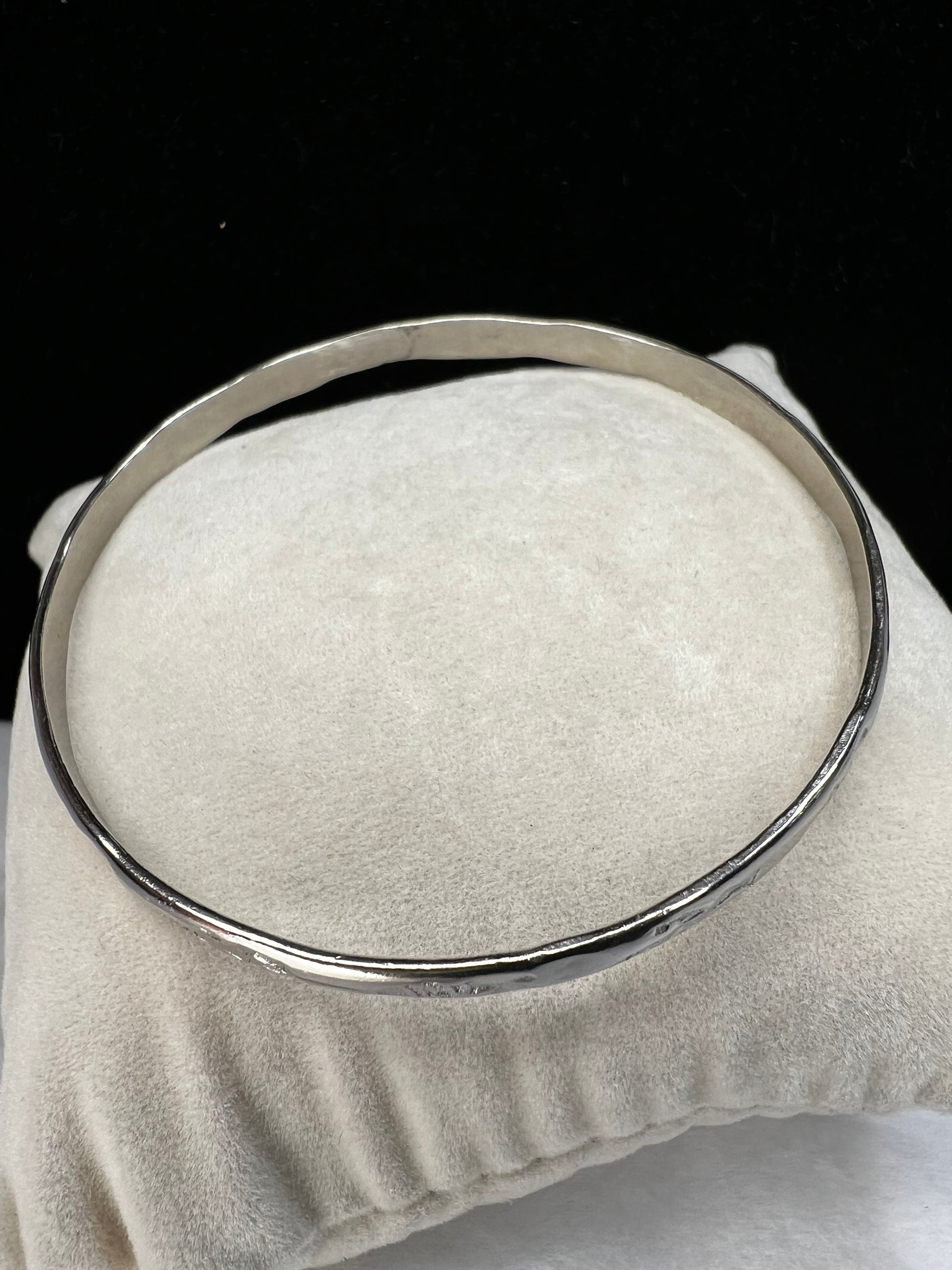 This sterling silver bangle bracelet is perfect for any outfit. It has designs around the entire outside and Mexican hallmarks on the inside.