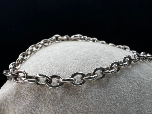 This beautiful sterling silver bracelet can be worn as is, or you can pair it with your choice of charms for a more personalized look.
