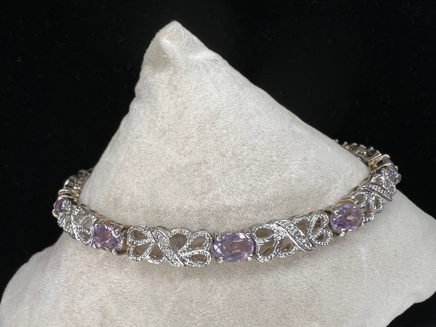 Add a gentle pop of color to your outfit with this elegant bracelet, which features amethysts.