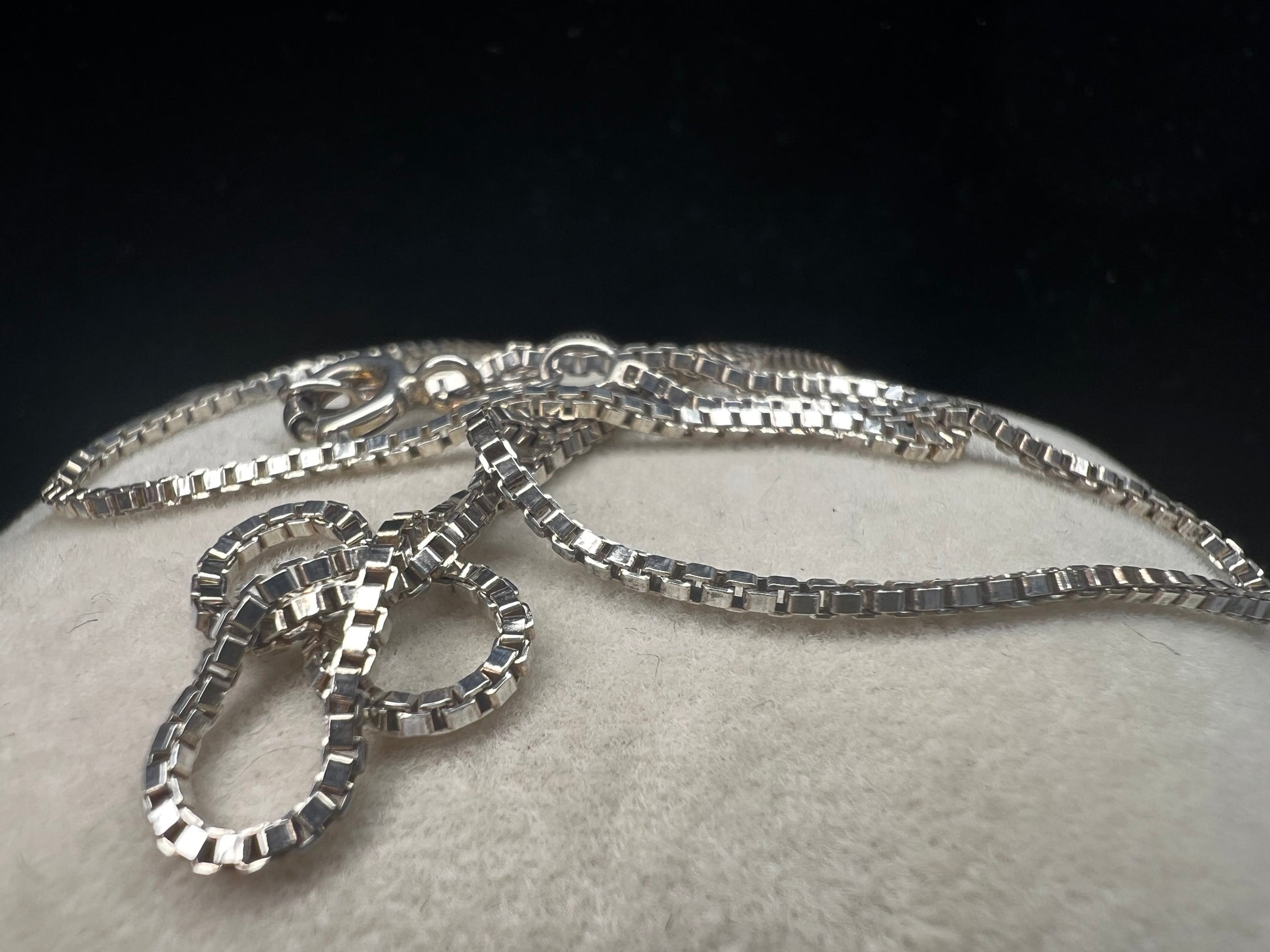 Enhance your style with our sterling silver thin box chain necklace. Perfect for day or night, this petite chain adds a touch of elegance to any outfit.