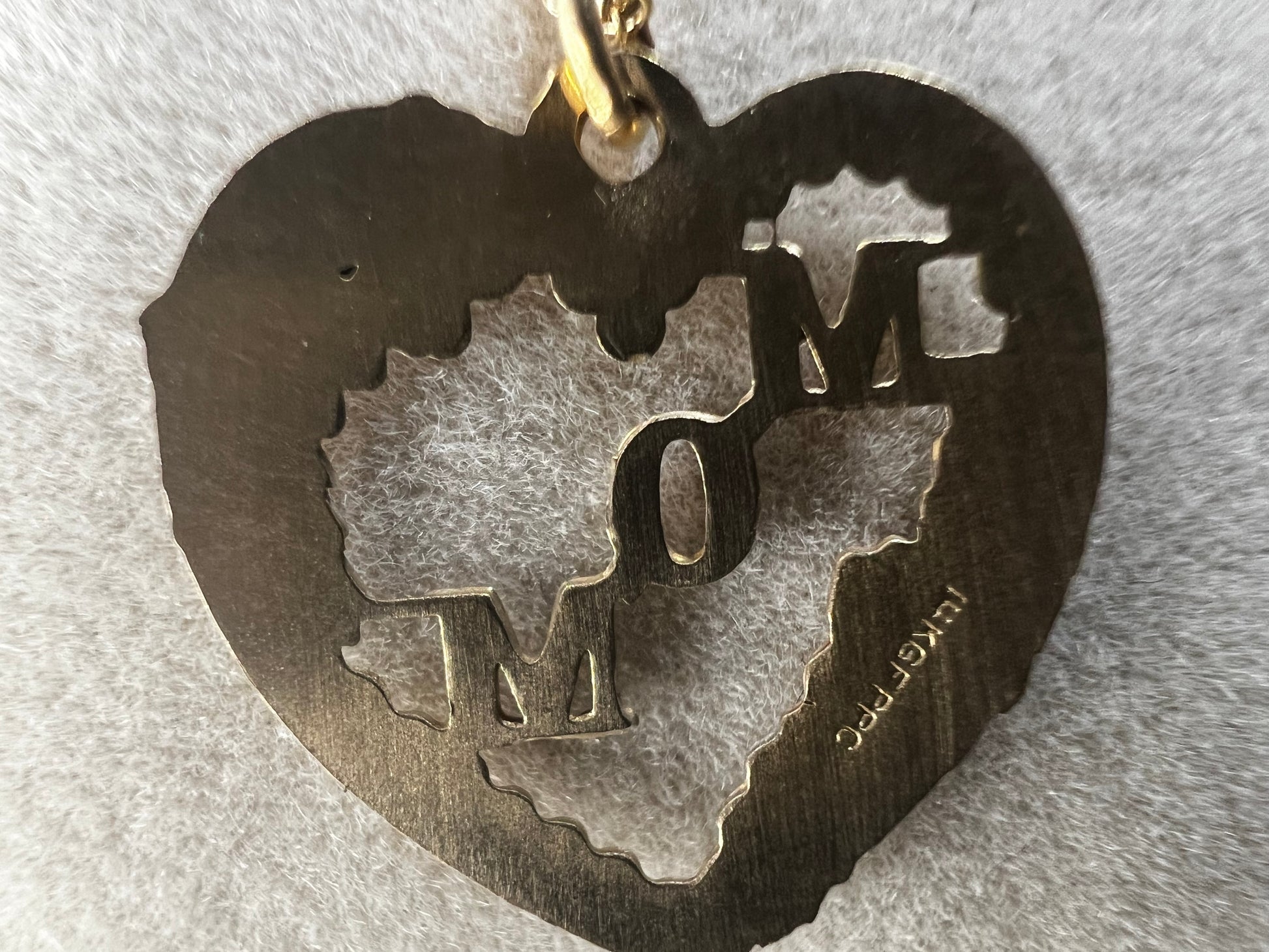 Show your mom some love with our 14 karat gold filled chain necklace and heart pendant. The chain features sturdy links with a delicate look, and the pendant has a touch of color through some enamel on the flower and silver leaves.