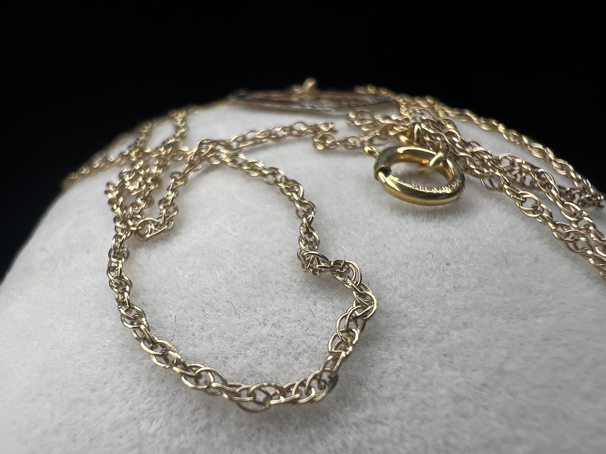 Show your mom some love with our 14 karat gold filled chain necklace and heart pendant. The chain features sturdy links with a delicate look, and the pendant has a touch of color through some enamel on the flower and silver leaves.
