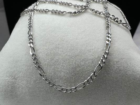 The classic look of the figaro link in this thin yet lengthy chain is just waiting for the perfect pendant to match your style.