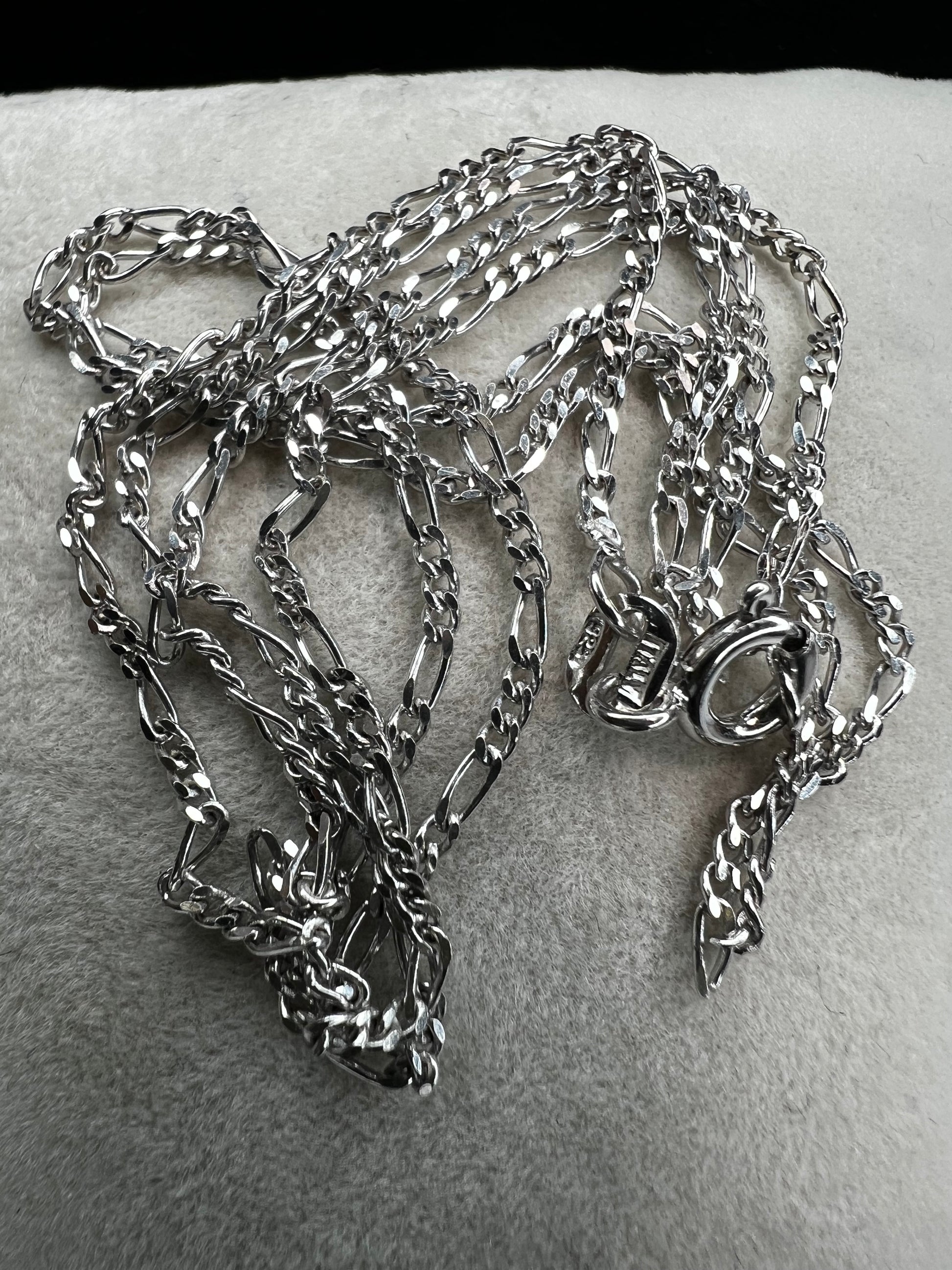 The classic look of the figaro link in this thin yet lengthy chain is just waiting for the perfect pendant to match your style.