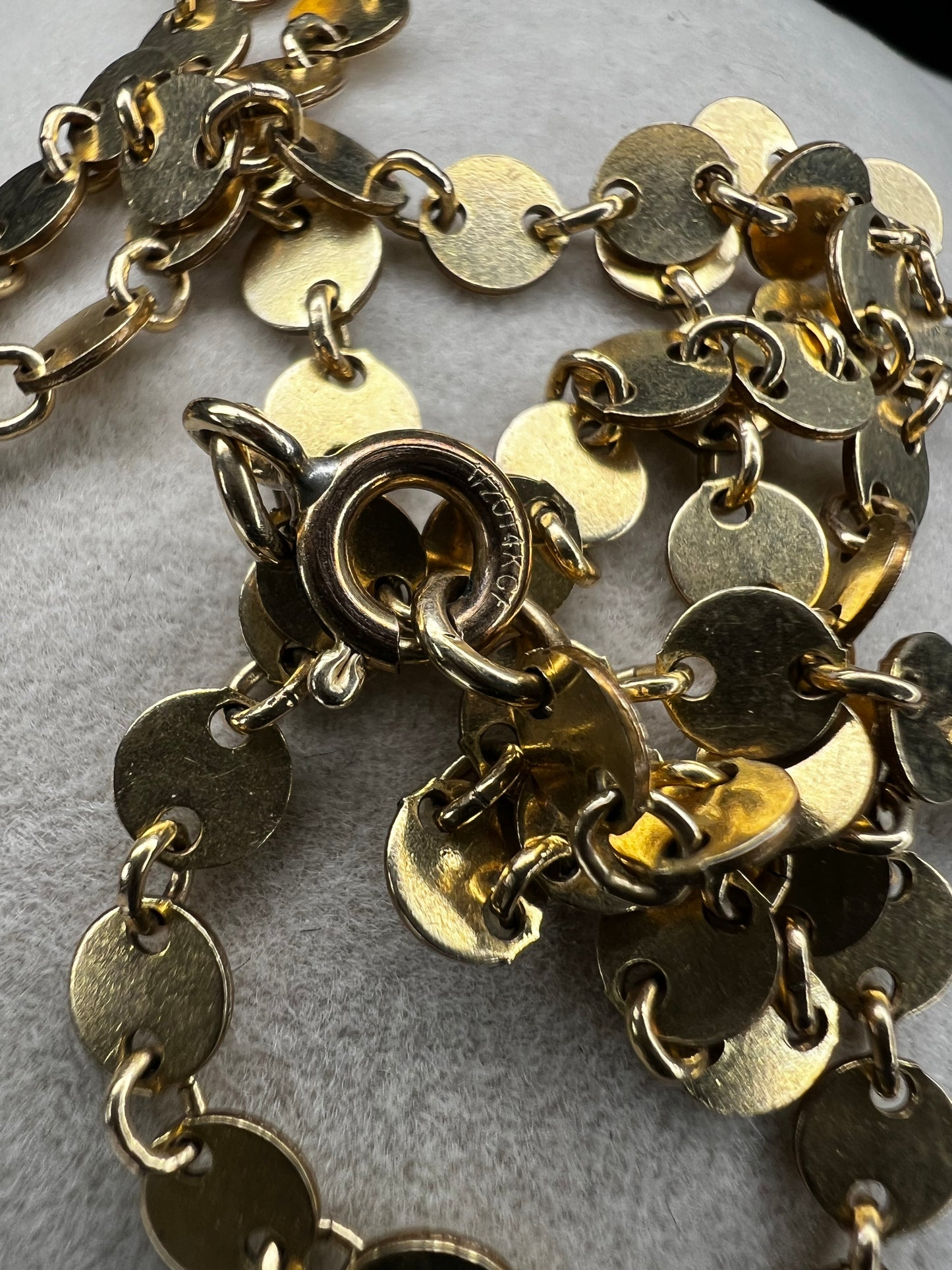 Add some sheen to your outfit with this gold filled necklace. The round flat links will make light dance around your neck.