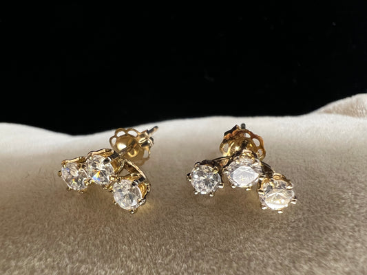 Add some sparkle to your outfit with this interesting pair of triple setting earrings. They feature cubic zirconia stones, so you get the look of diamonds without the higher cost.