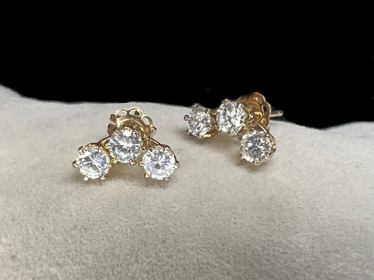 Add some sparkle to your outfit with this interesting pair of triple setting earrings. They feature cubic zirconia stones, so you get the look of diamonds without the higher cost.
