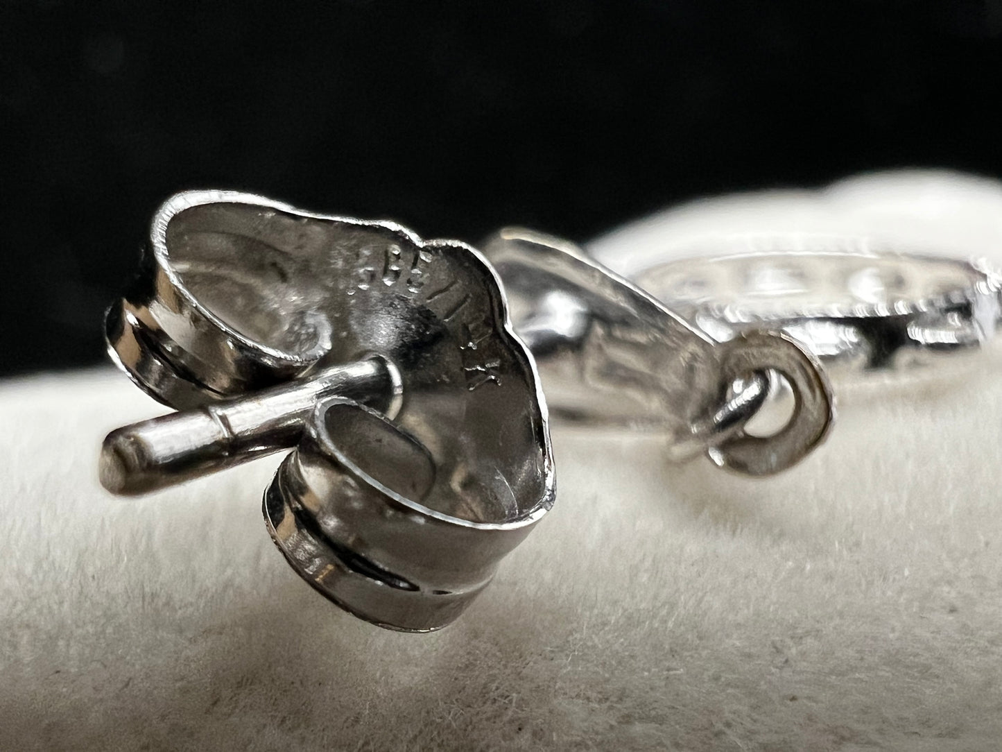 These earrings look like little tambourines. Crafted from 14 karat white gold, these would be perfect for any music lover.