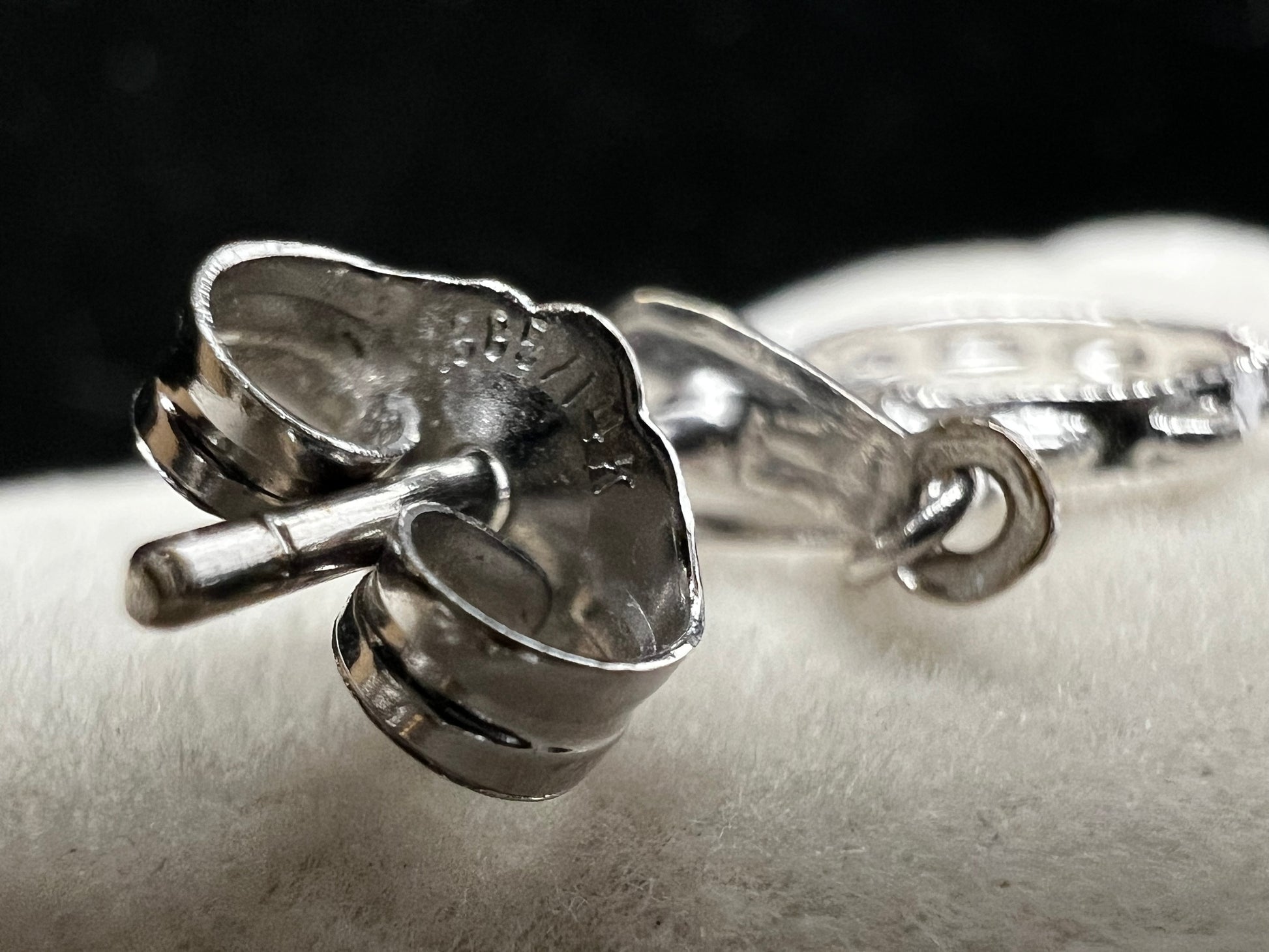 These earrings look like little tambourines. Crafted from 14 karat white gold, these would be perfect for any music lover.