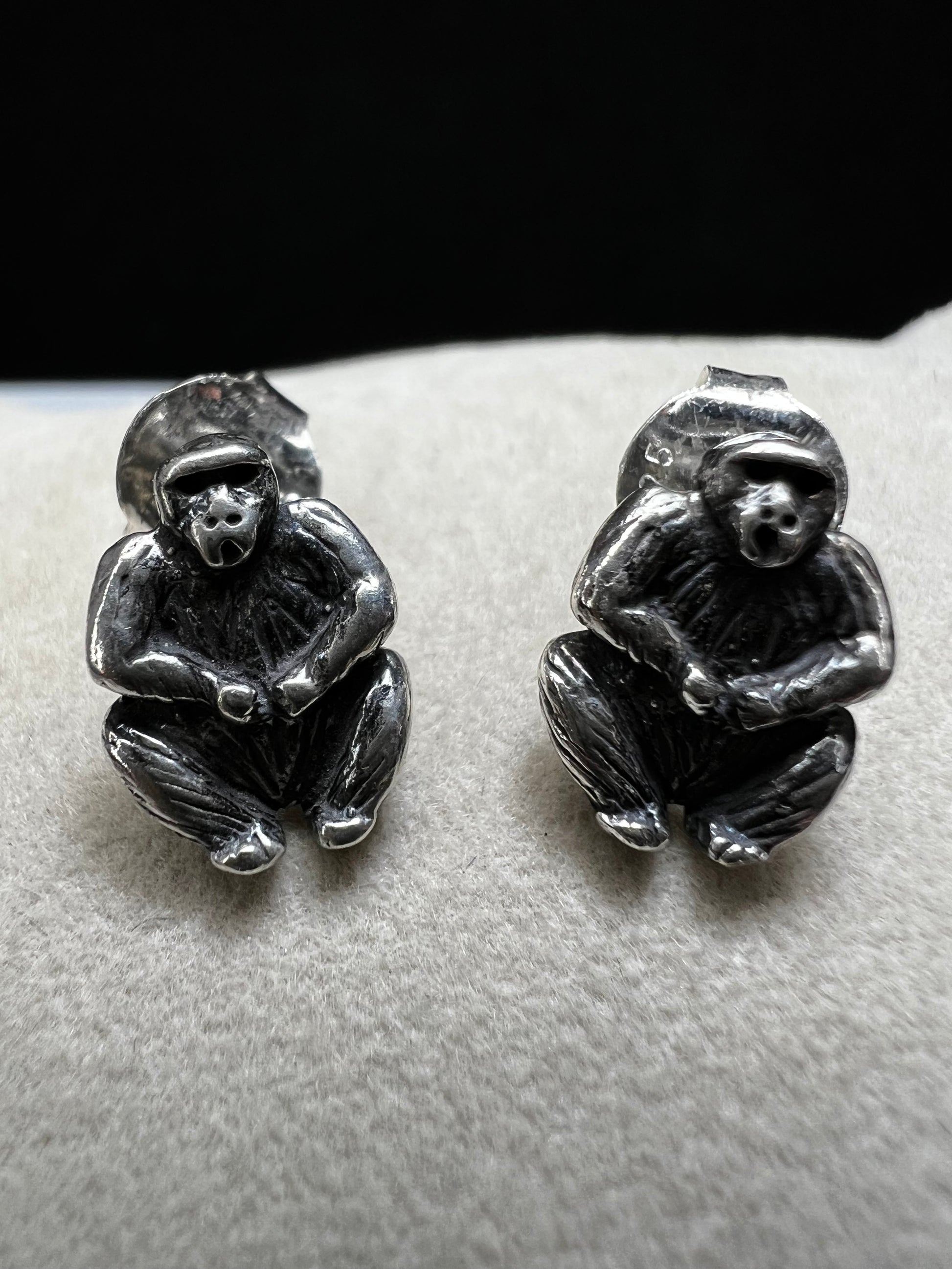 Crafted from sterling silver, these gorilla stud earrings combine playful charm with expert craftsmanship. Their compact size makes them perfect for everyday wear, adding a subtle yet distinctive touch to any outfit.
