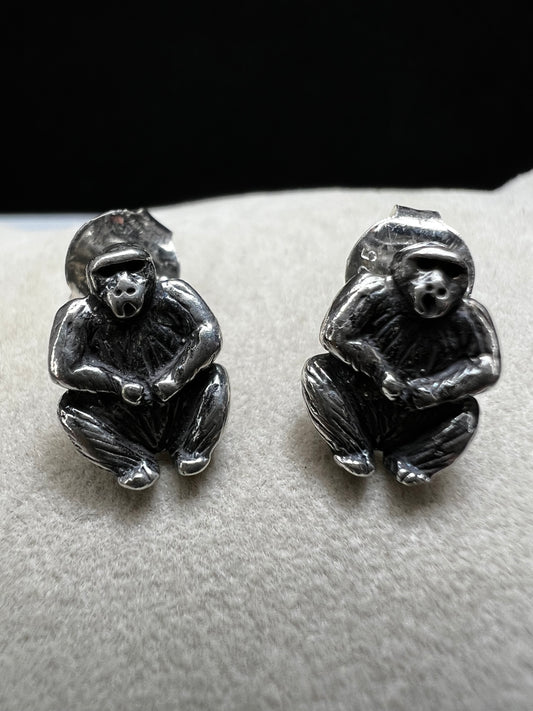 Crafted from sterling silver, these gorilla stud earrings combine playful charm with expert craftsmanship. Their compact size makes them perfect for everyday wear, adding a subtle yet distinctive touch to any outfit.