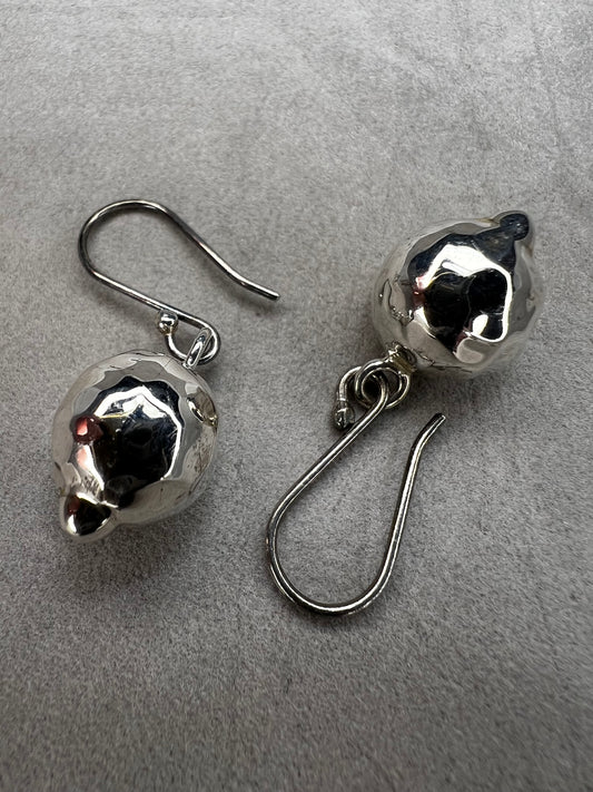 These sterling silver earrings are designed to add movement and shimmer to any outfit.